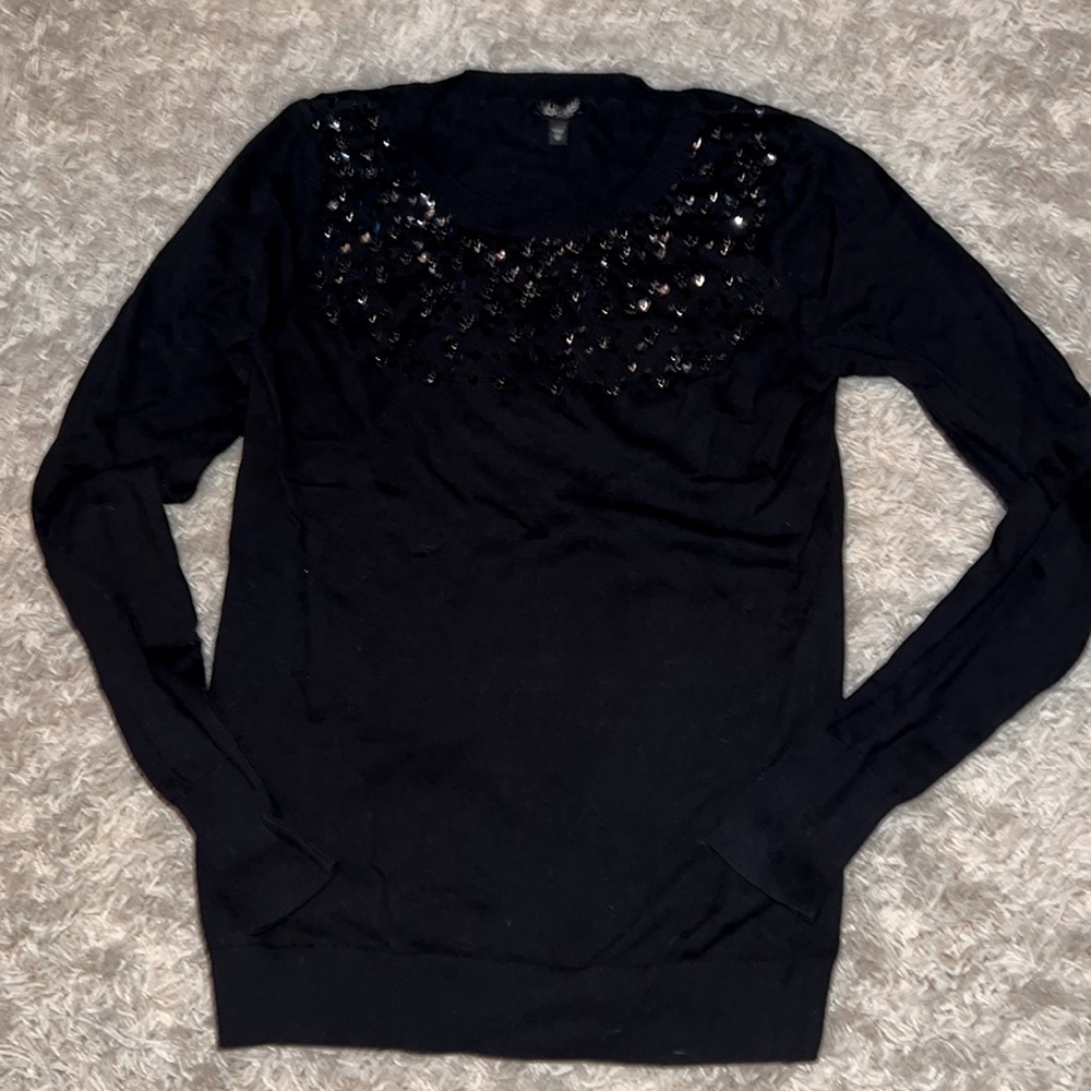 Express sweater with sequence detail. New without tags